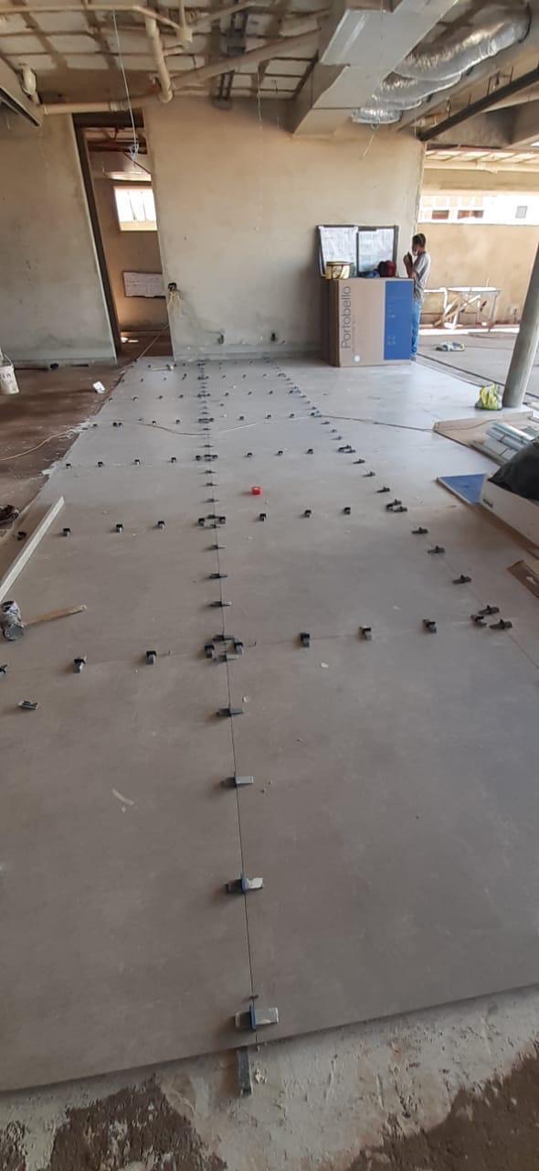 Large-format tile floor being installed in a commercial space by BBJ Flooring Corp